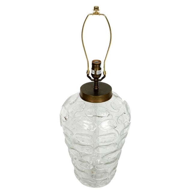 Vintage table lamp featuring a sculptural, clear, textured glass body with an organic pattern of raised, overlapping oval...