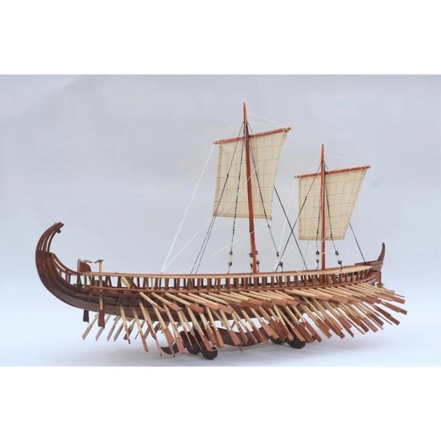 Step back into the era of legends with this meticulously handcrafted model of an Ancient Greek Trireme. The Trireme, an...