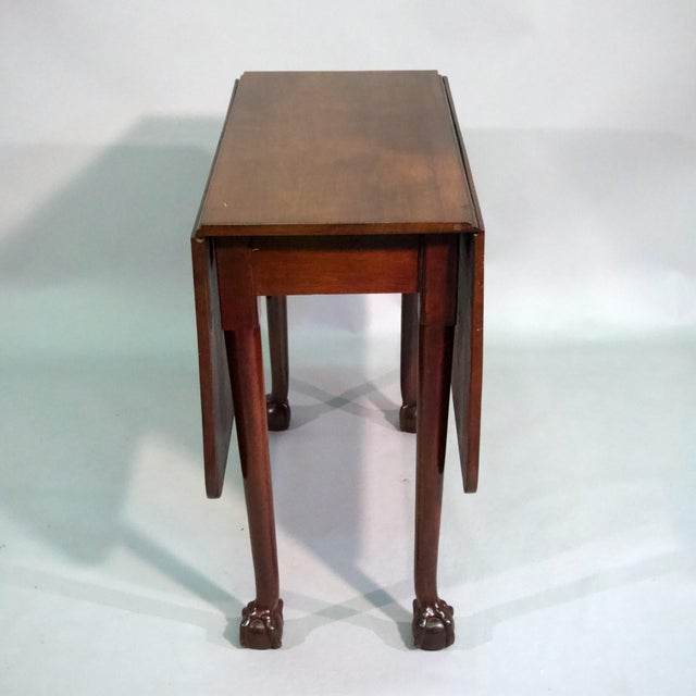 18th century George III mahogany drop leaf gate leg table. Each leaf supported by a swing leg . Each turned leg...