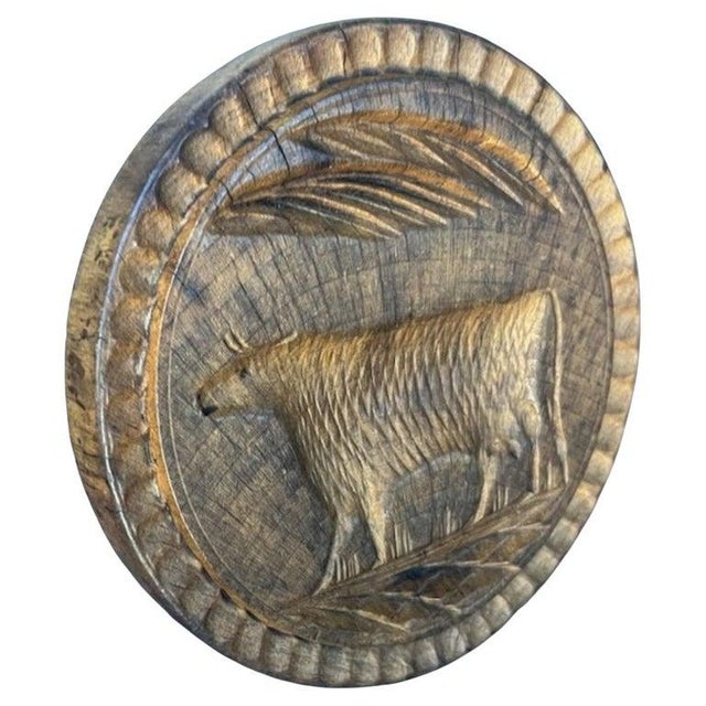This fine and folky hand carved cow butter stamp is in fine condition.This comes from a private folk art collection and...
