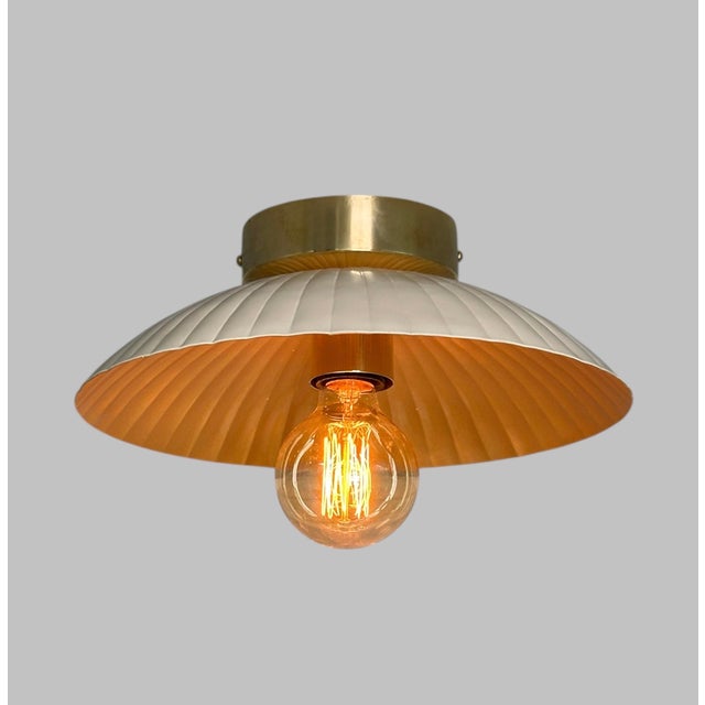 Elevate your space with timeless elegance and warm illumination using this 12-inch flush mount ceiling light. Featuring a...