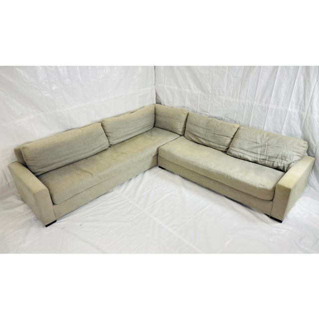 Elevate any contemporary living space with this Restoration Hardware two-piece sectional sofa, upholstered in a textured...
