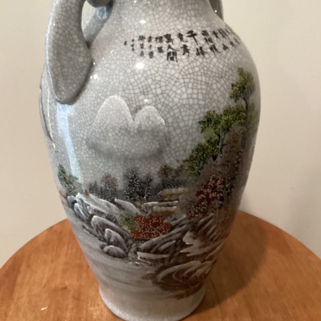 This Vintage Asian Celadon Crackle Glaze Vase features traditional landscape and calligraphy, making it a unique and...