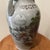 This Vintage Asian Celadon Crackle Glaze Vase features traditional landscape and calligraphy, making it a unique and...