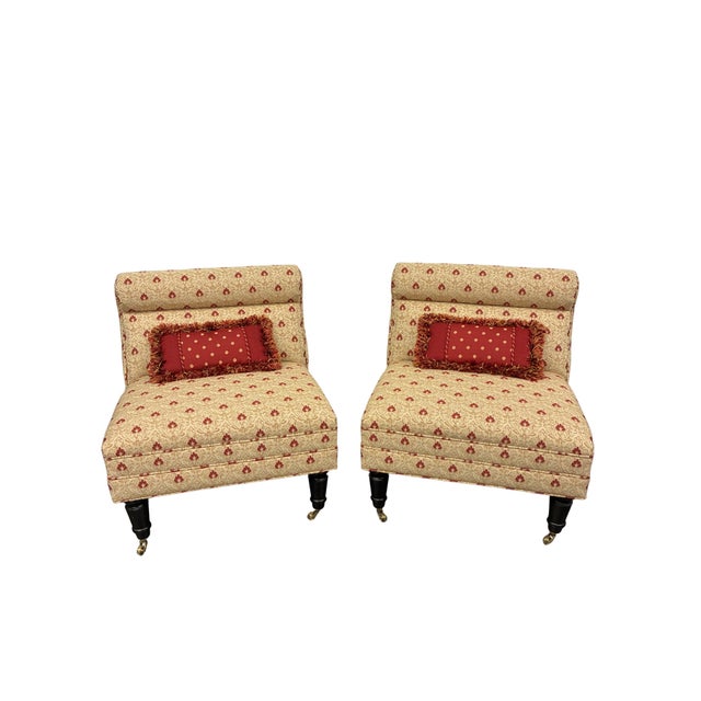 Charming pair of petite upholstered slipper chairs featuring elegant traditional styling, beautifully coordinated...