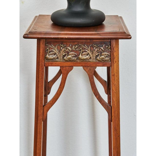 This elegant Art Nouveau pedestal is a masterful example of craftsmanship from the turn of the 19th and 20th centuries. It...