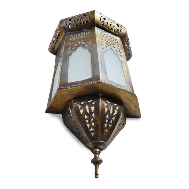 Beautiful brass work moorish wall sconce with frosted glass. Each may vary in aged brass patina. Use to cover an existing...