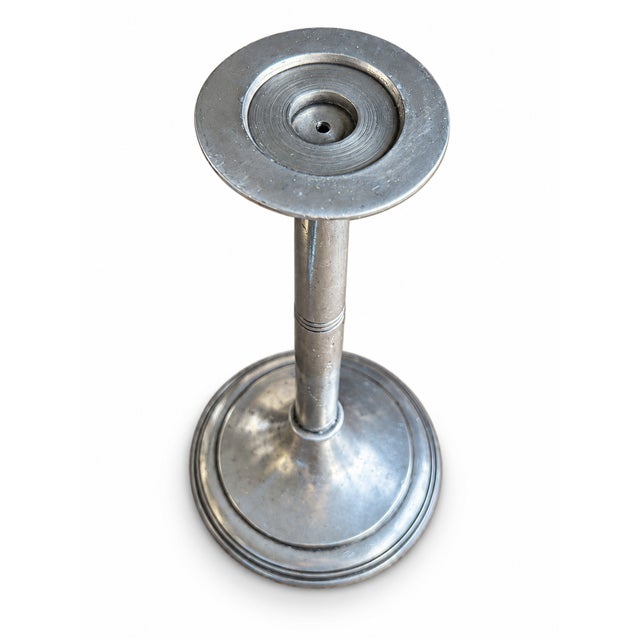 Italian pewter candlestick by Arte Italica with a soft silver-gray finish and substantial round base. An elegant accent...