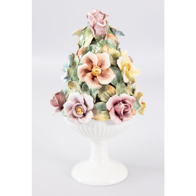 A beautiful vintage ceramic Italian topiary centerpiece, adorned with lovely pastel roses in a white fluted pedestal. Made...