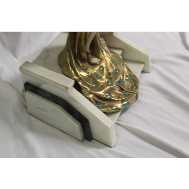 A very popular Deco sculpture of an Elegant lady in full dress walking down the Grand Steps. Cast in bronze with polished...