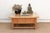 The thick, pale sycamore top on this table shows the kind of surface history that comes from a piece built for hard use...