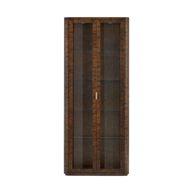 Finished in a luxurious Pyramid Brown with Satin Brass accents, this cabinet exudes timeless elegance and sophistication....