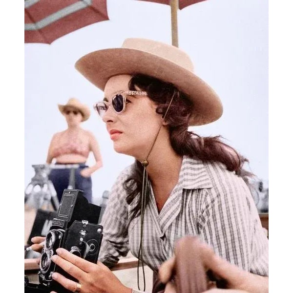 Elizabeth Taylor with Vintage Camera Actress Elizabeth Taylor takes a photo with a Rollieflex twin lens medium format...