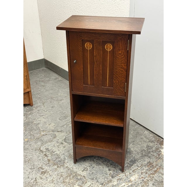 Design Plus Gallery presents the Harvey Ellis Inlaid Music Cabinet from Stickley Furniture. The cabinet (Model 89-476, #31...