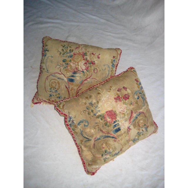 Splendid pair of pillows done with Aubusson tapestry presenting basket of flowers , volutes and more in the best taste of...