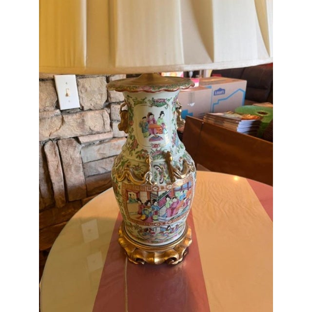 This is a 19th century style Chinese porcelain vase repurposed into a table lamp. It features the signature "Rose...
