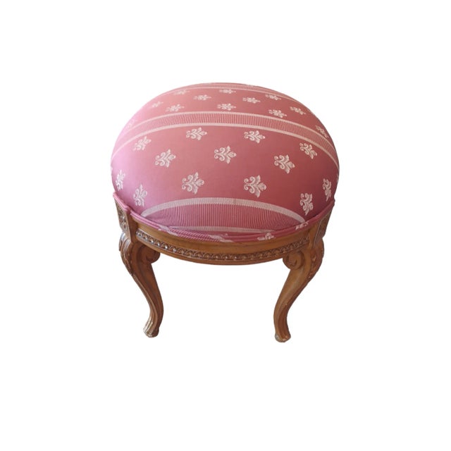 Vintage French style walnut and upholstered foot stool. Intricately carved base and legs