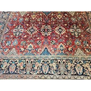 The vintage Persian Mahal Sultanabad room size rug with an allover design pattern of large geometric forms interwoven with...