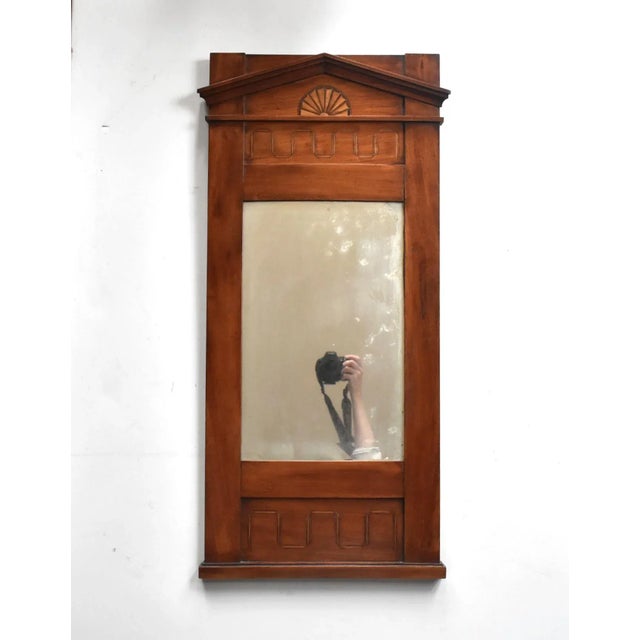 An antique, early 19th-century, c. 1820-1830, Swedish Biedermeier inlay marquetry wood pier or trumeau mirror in the...