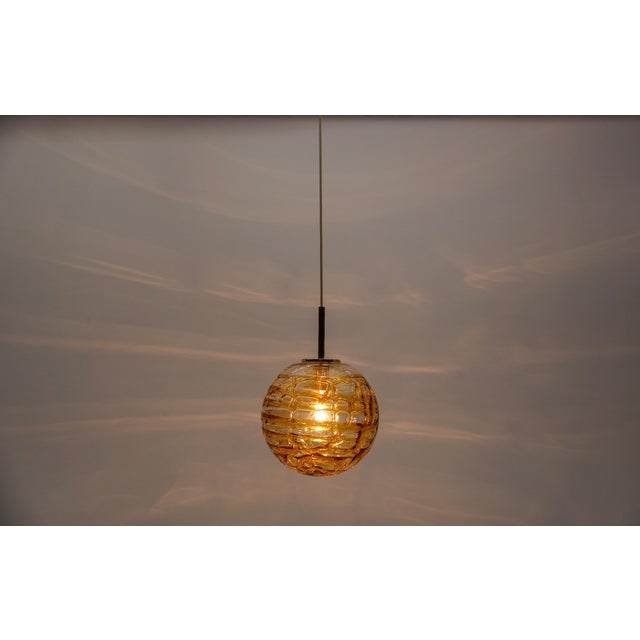 Lovely yellow murano glass ball pendant lamp by doria, - 1960s germany the height can be adjusted from 60 cm up to 105cm....