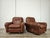 An elegant pair of brown leather armchairs from the 1970s, ideal for any modern or antique vintage setting. Note the...