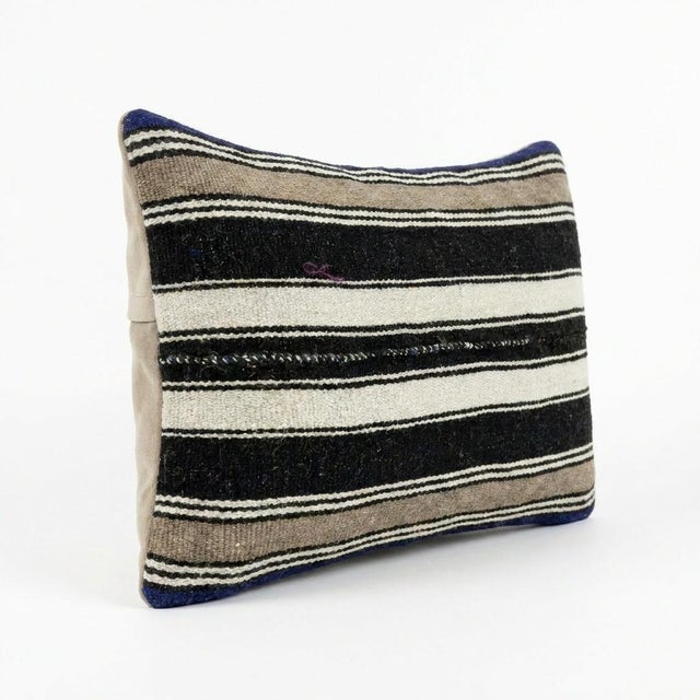 This beautiful 14'' X 24'' pillow cover was made from an authentic Turkish Kilim. Bright colors of wool adorn the front of...