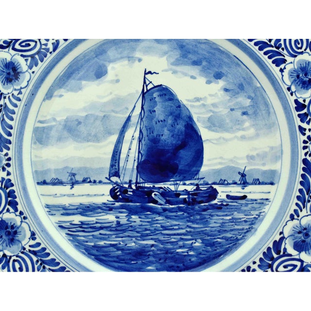 Add a touch of classic Dutch charm to your home decor with this exquisite Mid 20th Century Hand Painted De Delftse Pauw...