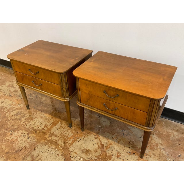 A great pair of walnut nightstands or end tables featuring beautiful fluted edges, each with two drawers in wonderful...