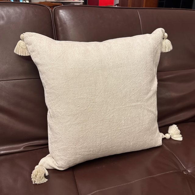 Design Plus Gallery presents a Serena & Lily Tassel Accent Pillow. Woven in a soft neutral tone, this square pillow has a...