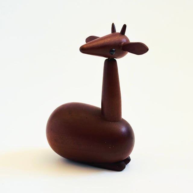 A mid century turned wood figurine in the shape of a deer. Adorable stylized features. Made in Japan by Senshukai as part...