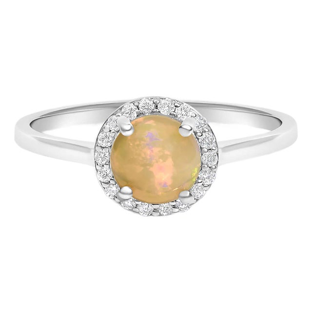 10K White Gold Opal and 1/10 Cttw Diamond Halo Ring For Sale