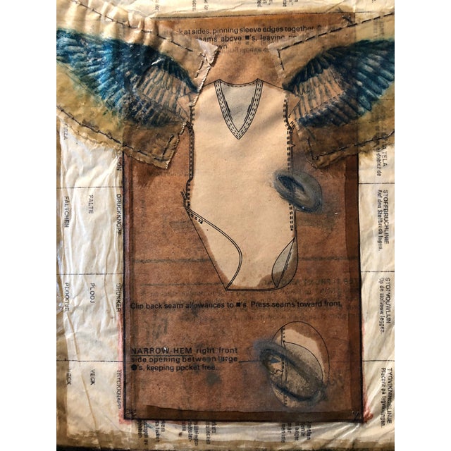 An assemblage glued, painted and drawn. gossamer fragile angel or lover wings.