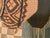 Light brown square needlepoint pillow. It measures 16 x 16 inches. Please note this piece ships flat and without an insert.