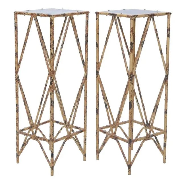 A Rare Pair of French Chinoiserie-style Pedestal Stands, with slender hand-forged iron frames, hand-painted to mimic the...