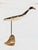 Elegant stylized folk art egret sculpture atop a metal pole and driftwood base. Rotates 360 degrees for perfect placement...