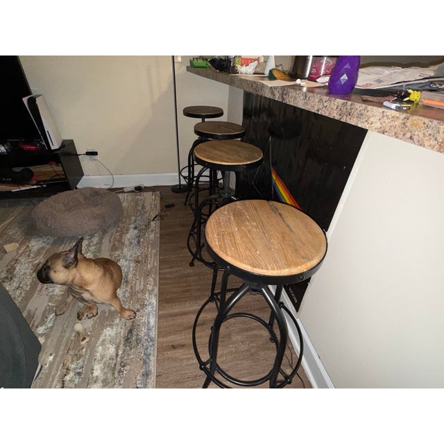 These are Farmhouse Wood + Iron Round Adjustable Stools by Design Mix Furniture