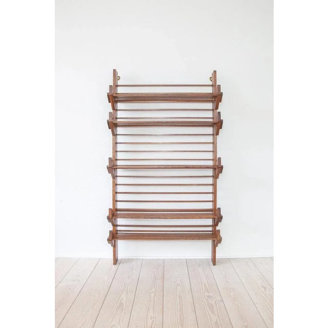 The wonderfully aged oak shelf comes from Italy and was made around 1940. It is in very nice condition with a great,...