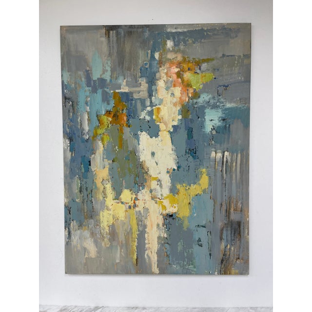 A rich and layered original oil painting on canvas featuring a moody palette of slate blue ochre ivory and soft green....