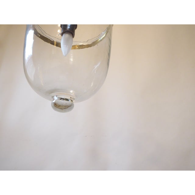 This blown glass bell light uses a single Edison base bulb up to 100 Watts.