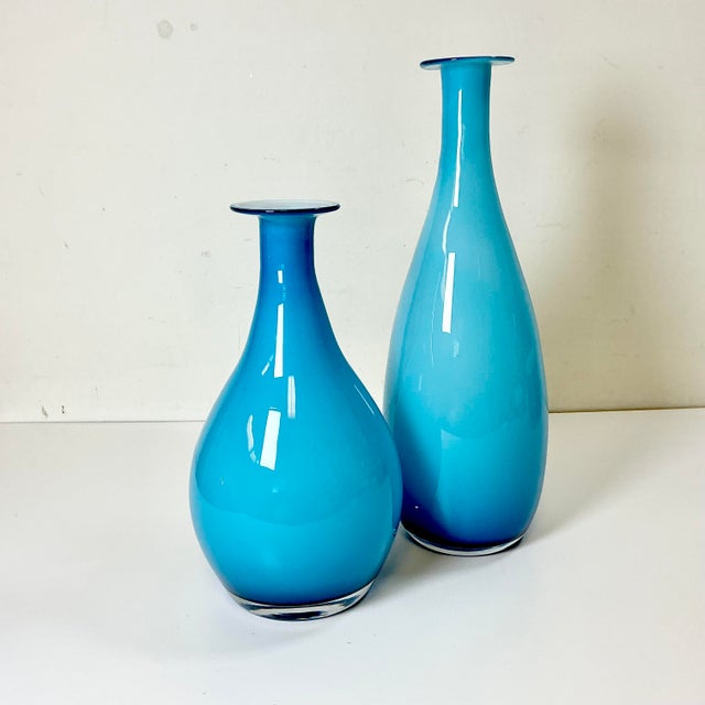 The color is simply gorgeous. This pair of Venetian blown glass teardrop Vases from Italy are a Tiffany Blue encased with...