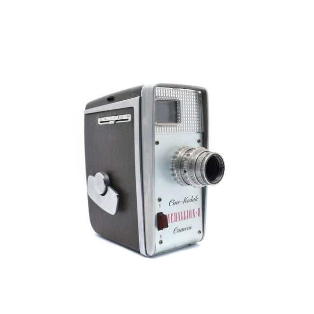 Capture the essence of mid-century nostalgia with this vintage Cine-Kodak Medallion 8 Movie Camera, a quintessential piece...