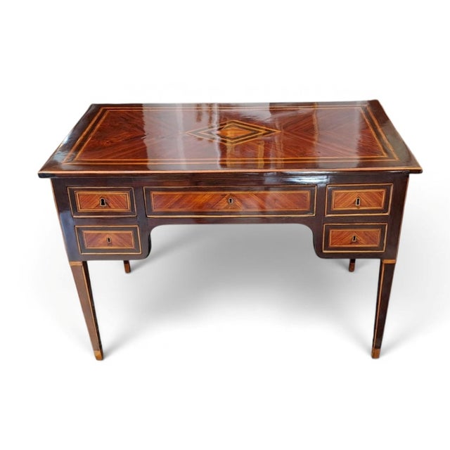 An elegant center desk (bureau plat) from the Neoclassical era (Louis XVI style), attributable to the Southern Italian...