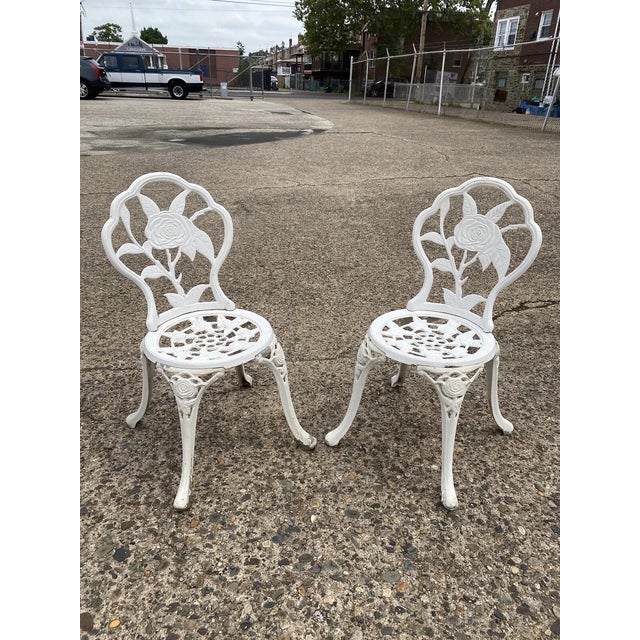 Contemporary Victorian Style Rose Pattern Cast Aluminum Garden Patio Outdoor Bistro Chairs. Circa 21st Century, Pre-owned....