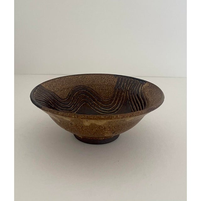Mid-Century ceramic pottery bowl. Shades of brown with abstract design. Great styling for a nightstand, coffee table and...