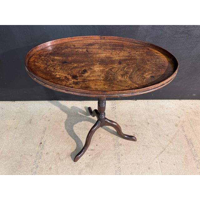 A lovely Georgian Tilt Top Table being a very rare oval shape to the top. Made from Mahogany which retains a warm original...