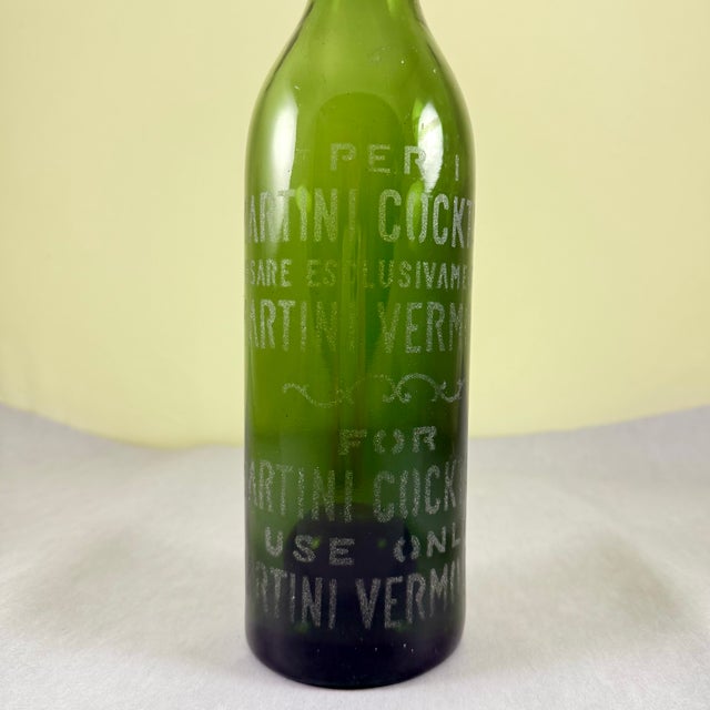 An antique French acid-etched Martini Vermouth bottle circa early 1900s. Vermouth is a key herb-infused wine used in...