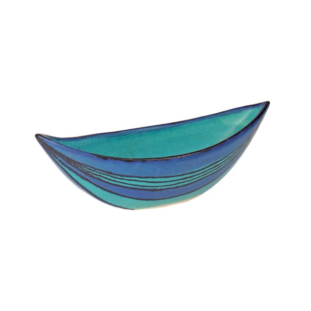 A ceramic canoe boat bowl in the Gulfstream pattern designed by artist Fong Chow (1923-2012) for Glidden Pottery Inc. This...