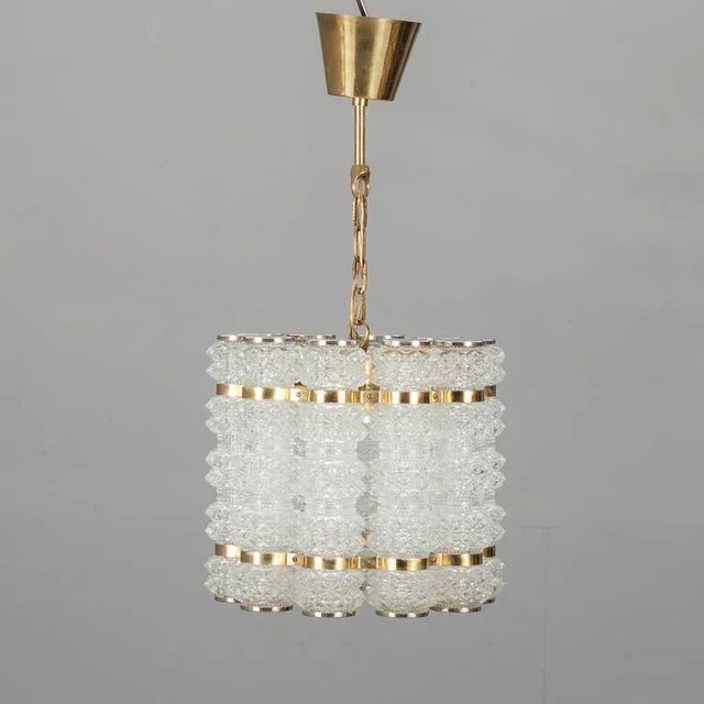 Tyringe tubular crystal & brass pendant brass and crystal tubes pendant by tyringe konsthantverk (tyringe crafts), sweden....
