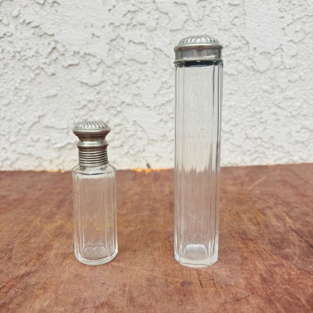 A beautiful matched pair of vintage Art Deco vanity perfume bottles, dating circa 1925–1940. These elegant dresser bottles...