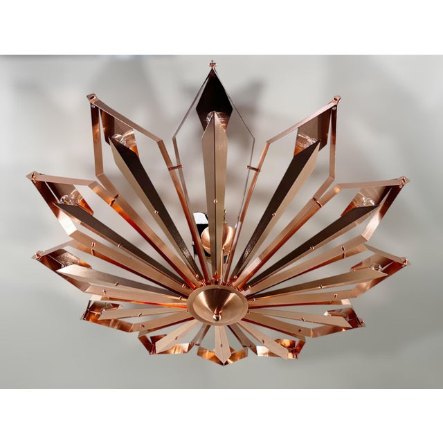 Elegant Italian flush mount with satin copper finish frame handcrafted to resemble a convex dahlia flower, designed by...